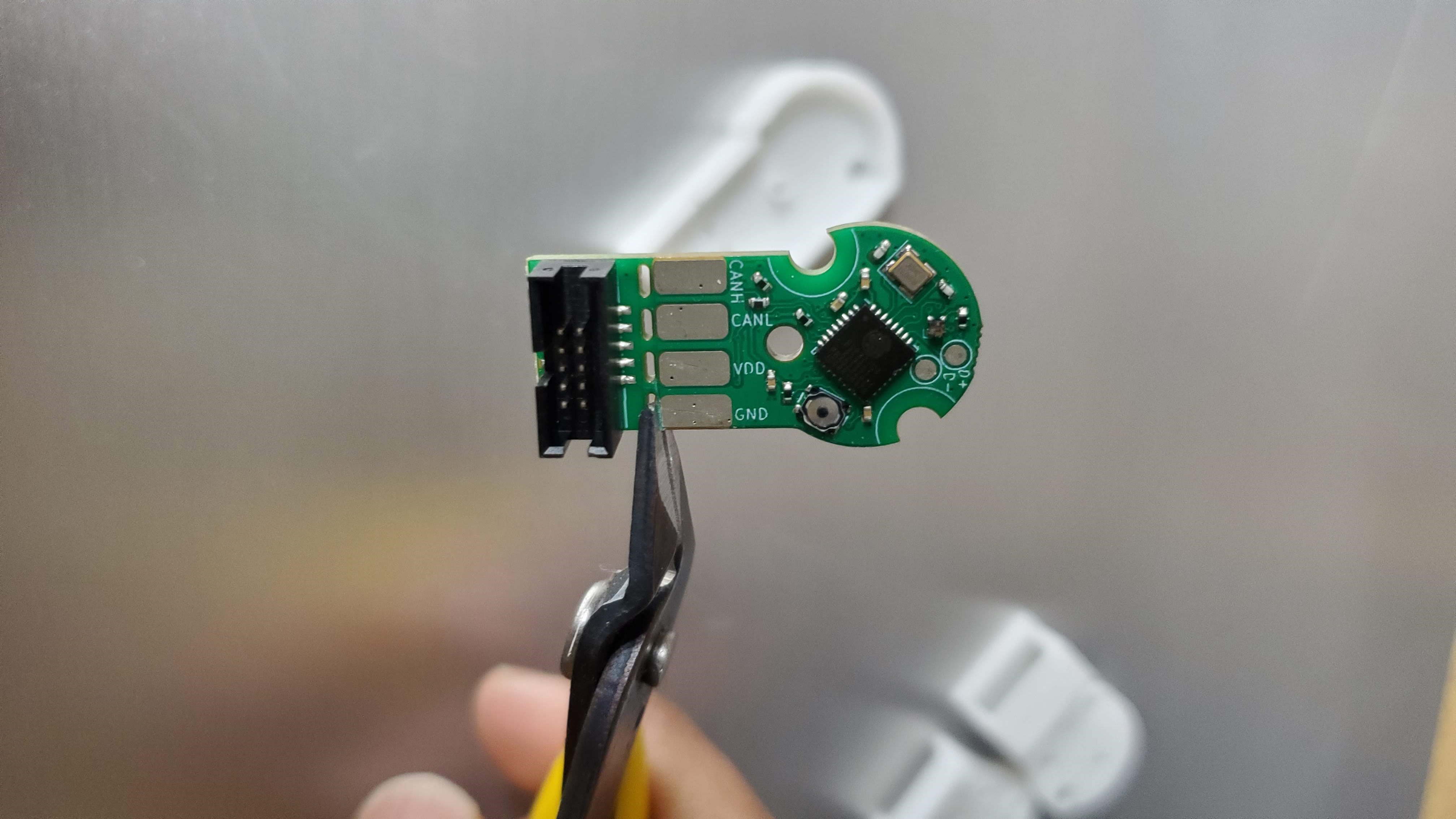 Canandmag being held by flush cutters